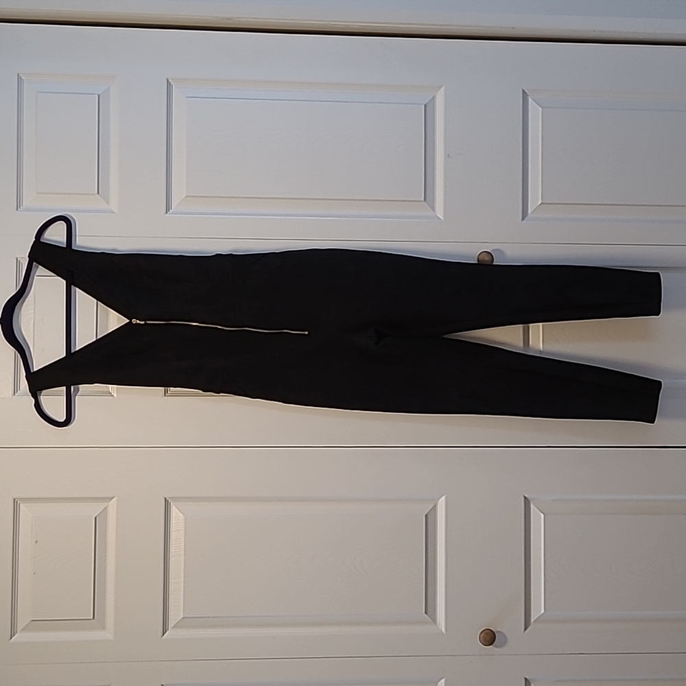 Bebe suede jumpsuit with gold zipper